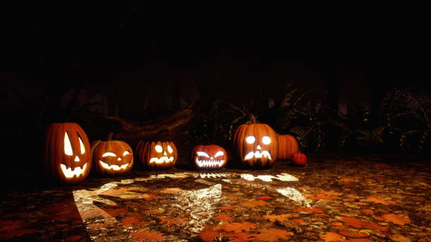 istock Halloween pumpkins in scary autumn forest at night 1054787348