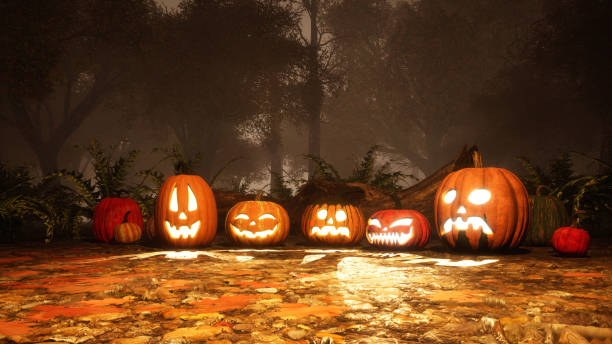 istock Various Jack-o-lantern pumpkins in misty forest 1054787368