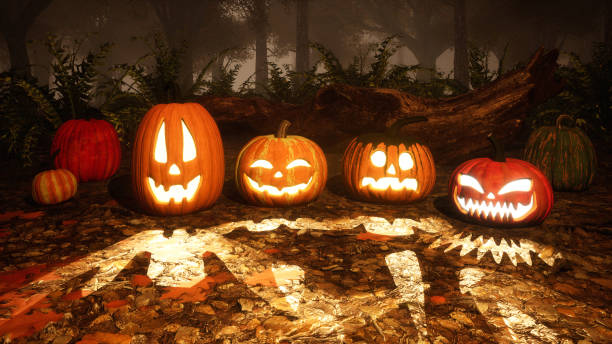 istock Carved halloween pumpkins in misty autumn forest 1054787468