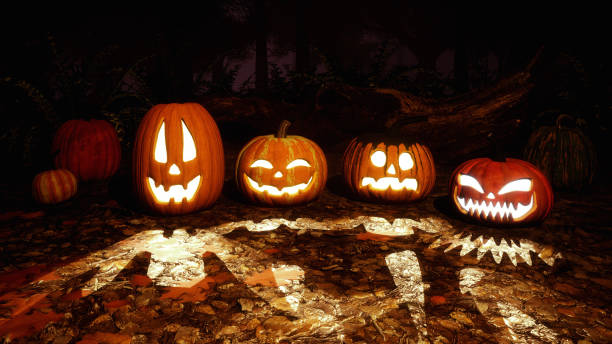 istock Carved halloween pumpkins in night autumn forest 1054787492