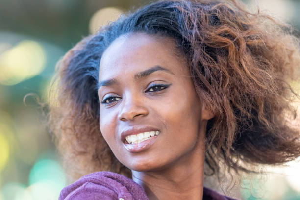 istock Smiling beautiful young black woman 1054787604