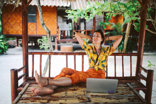 istock Young woman doing her freelance work outdoors in Thailand 1054787998