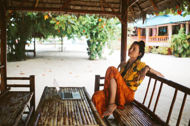 istock Young woman doing her freelance work outdoors in Thailand 1054789568
