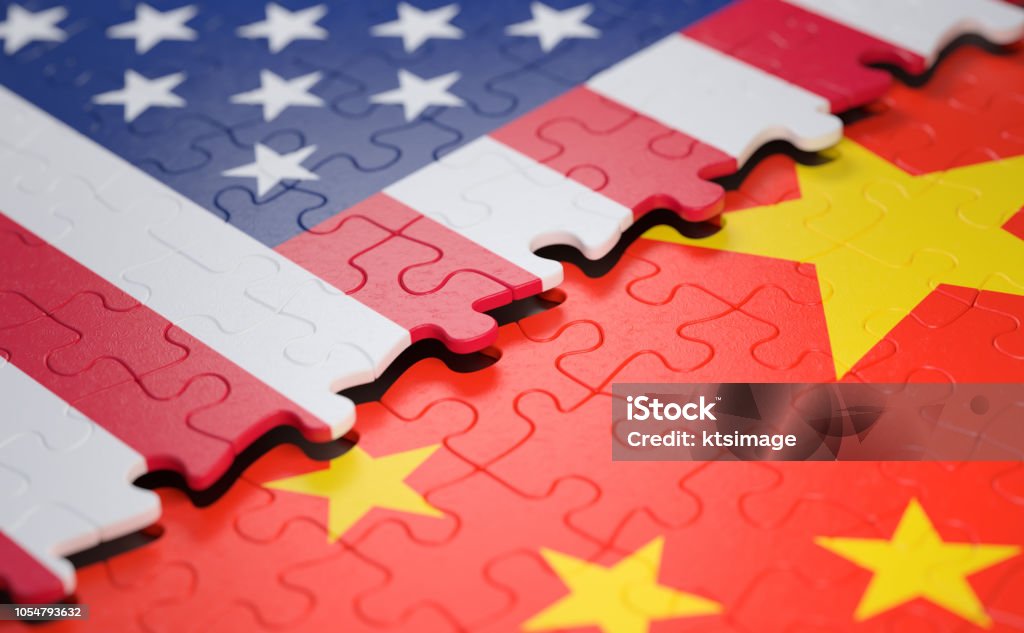 Economy Ecology Social Nations In Peace And Together Two nations joining in a puzzle game that represents union, peace, commerce, social and human agreement. For peace and well-being of nations in the world. Free from ecological problems in favor of planet Earth. China - East Asia Stock Photo