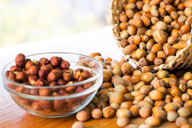 istock Hazelnuts in a wicker basket on old wooden table 1054793980