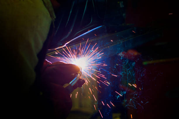 istock sparks during welding at the production process in semi-automatic welding of metal in argon protective gases 1054794290
