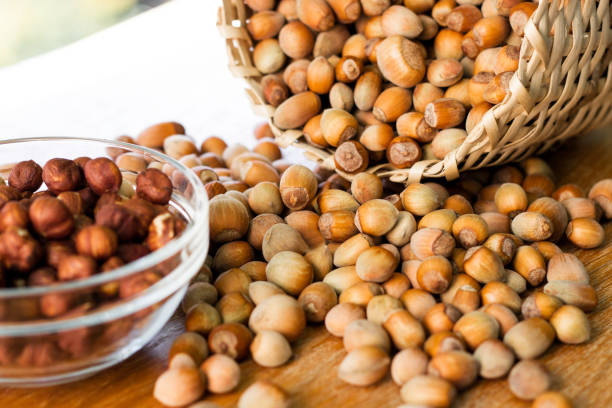 istock Hazelnuts in a wicker basket on old wooden table 1054794394