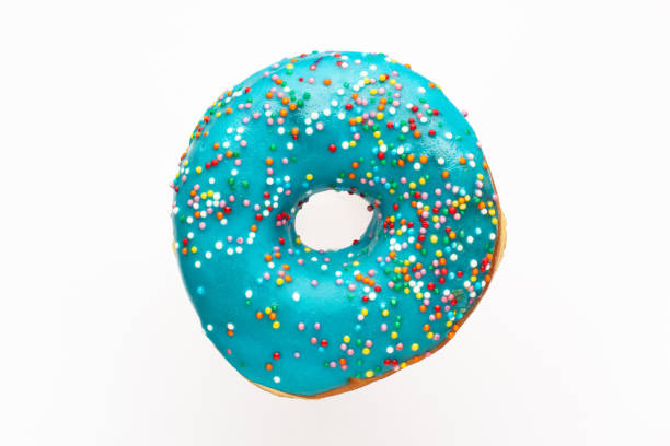istock Donut blue with sprinkles isolated on white background, close-up 1054794486