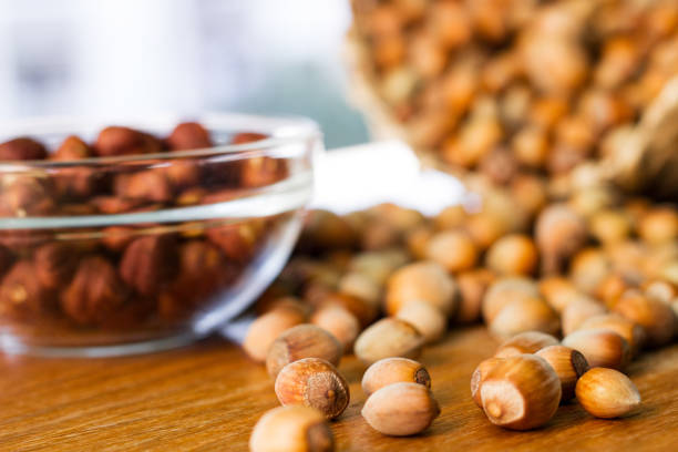 istock Hazelnuts in a wicker basket on old wooden table 1054794574