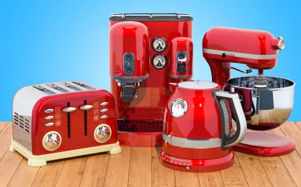 Red stainless electric tea kettle, coffeemaker, toaster, mixer. Retro design on the wooden table. 3D rendering