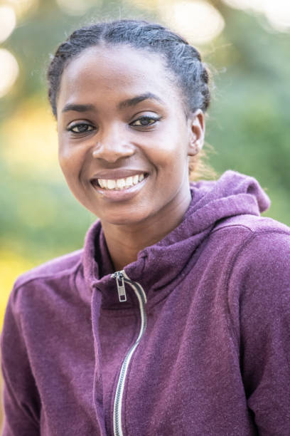 istock Smiling beautiful young black woman 1054812336