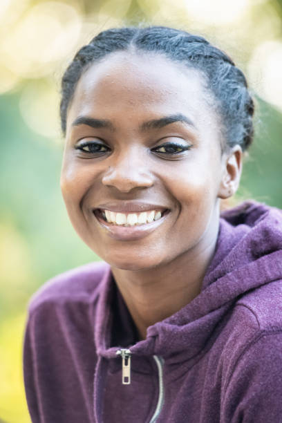 istock Smiling beautiful young black woman 1054812366