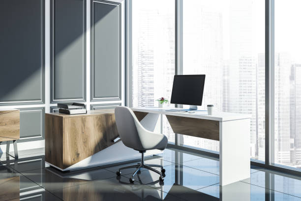 istock Gray panel loft manager office corner, wooden desk 1054816144
