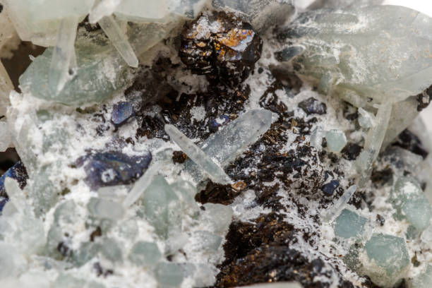 istock Macro mineral stone Drusus quartz with sphalerite in the rock a white background 1054818428