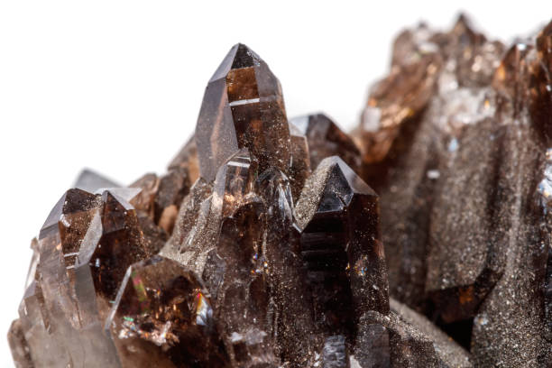 istock Macro mineral stone Morion crystal in the rock a white background 1054818492