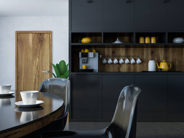 istock Comfortable black and wooden dining room interior 1054818636