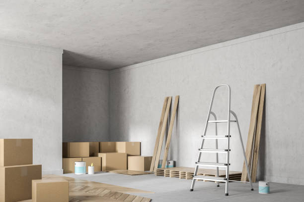 istock Concrete room corner with unfinished wooden floor 1054818978