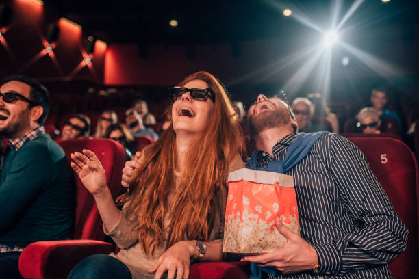istock Laughing couple at cinema 1054821484