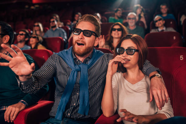 istock Couple in love watching 3D movie 1054821820