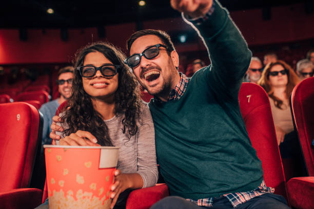 istock Couple eating popcorn at cinema 1054823118