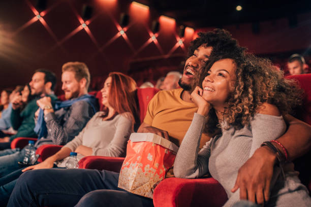istock Young people hugging at cinema 1054826534