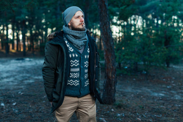 istock Portrait brutal bearded hipster man in the forest 1054828906