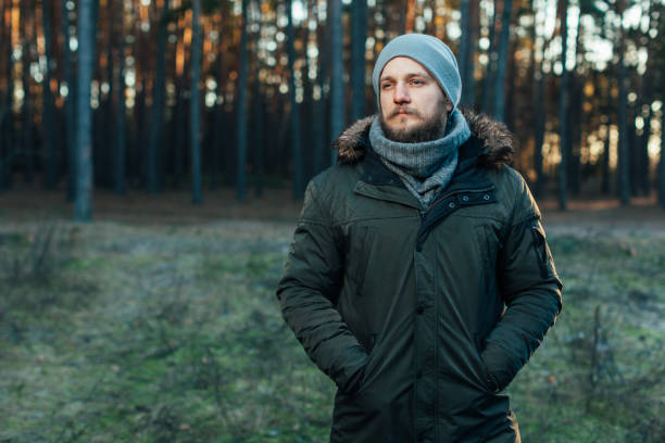 istock Portrait brutal bearded hipster man in the forest 1054829076