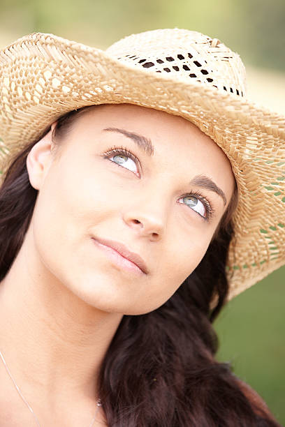istock girl wearing summer hat 105483150