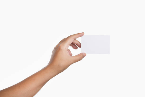 istock Hand holding blank card isolated on white background. 1054834810