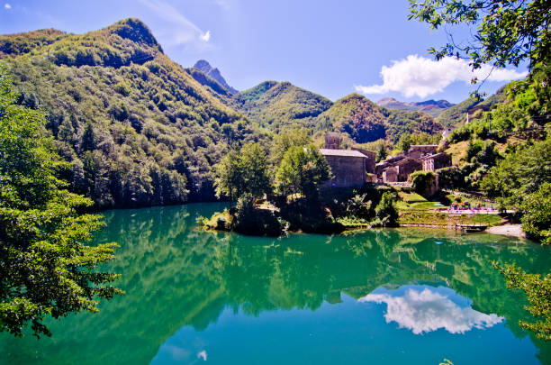 istock mountain lake with small hamlet and historic church 1054835132