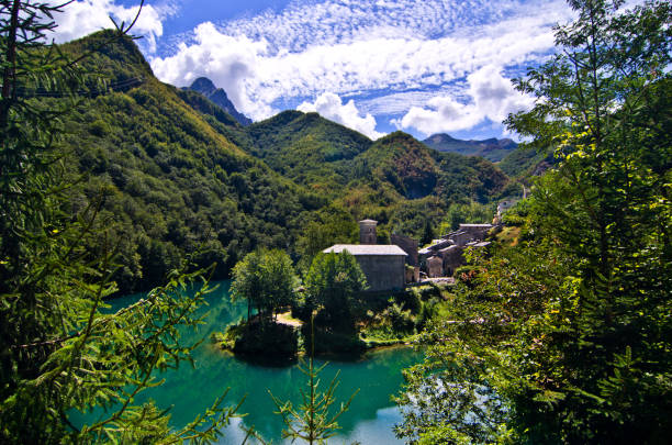 istock mountain lake with small hamlet and historic church 1054835142