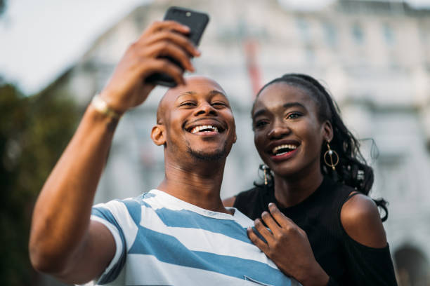istock Non-caucasian tourists taking selfie 1054837904