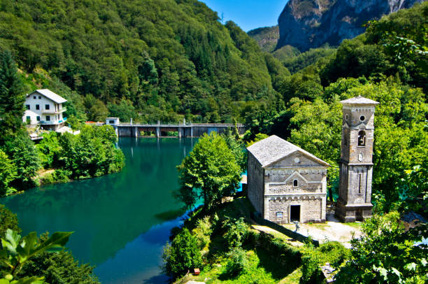istock mountain lake with small hamlet and historic church 1054848070