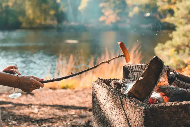 Photo of Senior women grilling sausage in Sweden