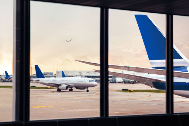 istock View of airplane fuselage tail through window at airport 1054855564