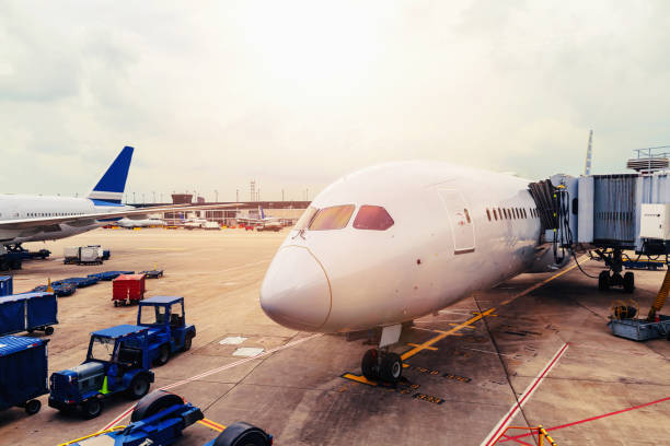 istock View of airplane front on tarmac with cargo at airport 1054855708