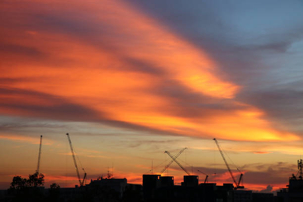 istock Silhouette construction and sunset nature cloudy beautiful sky 1054860904