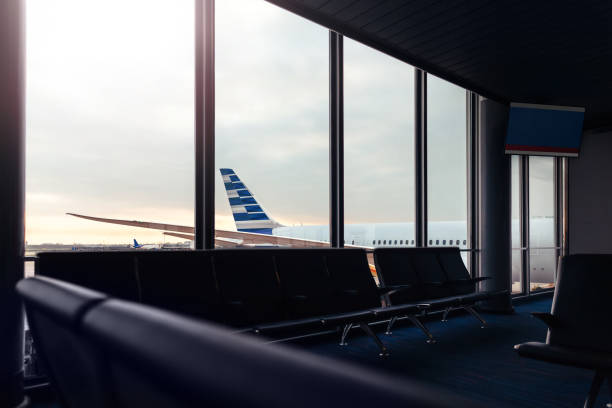 istock Airport lounge with background view of airplane through window 1054862364