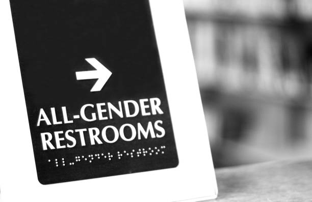 Gender Neutral "All-Gender Restrooms" Sign (Close-Up) Gender Neutral “All-Gender Restrooms" Sign (Close-Up) gender neutral photos stock pictures, royalty-free photos & images