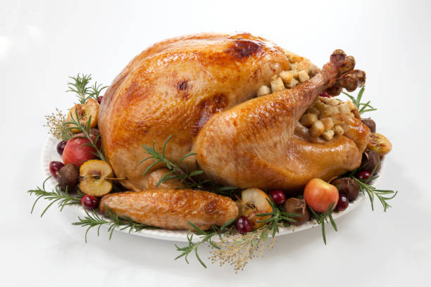 istock Roasted Turkey with Grab Apples over white 1054874710