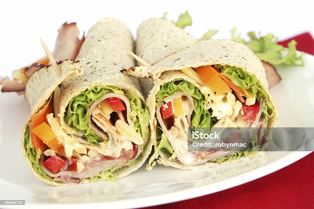 Ham sandwich wrap sliced in half Ham wrap sandwich with salad and mayonnaise. Mayonnaise Stock Photo