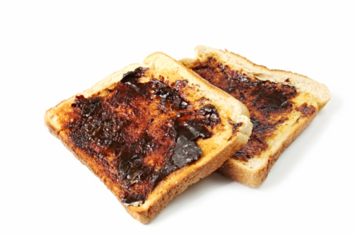 Vegemite on toast.  This yeast extract spread is an Australian icon. http://robynm.smugmug.com/photos/175558603-L.jpg 