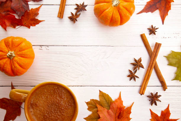 istock A Fall Themed Border with Real Leaves Pumpkins Spices and Hot Latte 1054889864