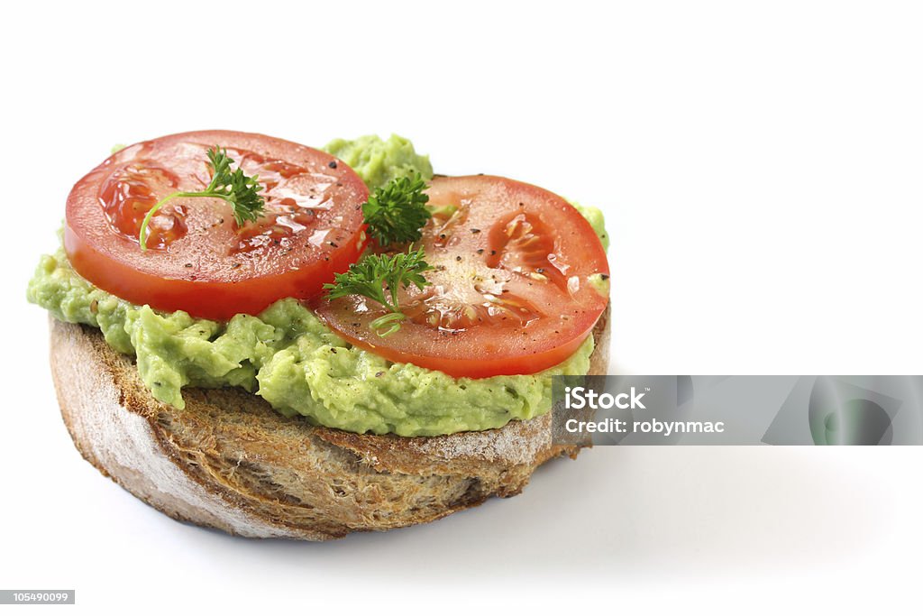 Avocat et de la tomate sur un Toast de pain de seigle - Photo de Pain grillé libre de droits