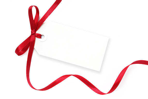 istock A blank, white tag with a flowing red ribbon tied on it 105490265