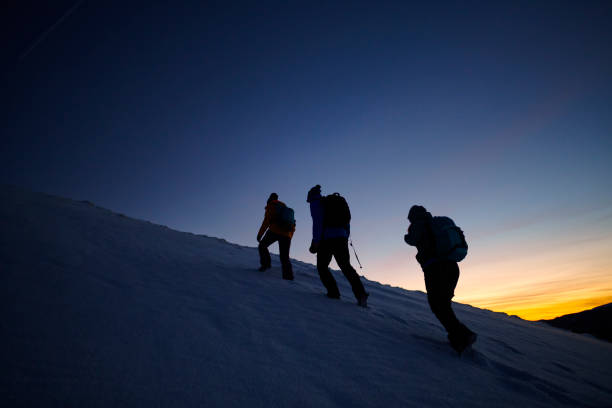 istock hikers moving up on the mountain 1054904646