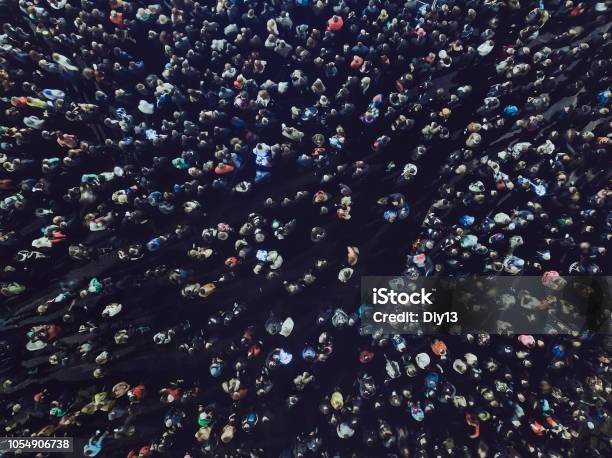 An Aerial Shot Of The People Gathered For An Event Crowded Openair Meeting At The Black Background A Mass Of People Gathered To Celebrate An Event Openair Night Festival City Merrymaking Stock Photo - Download Image Now