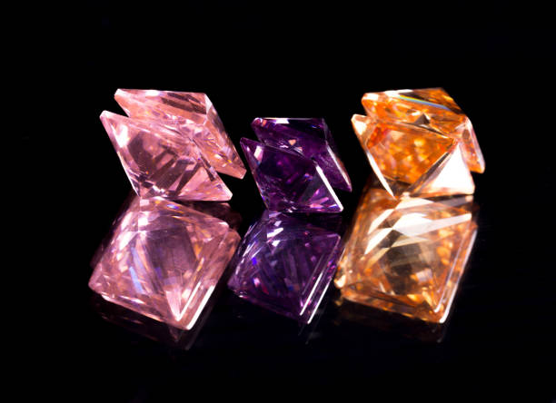 istock Fake colorful diamonds on black background. close up 1054910128