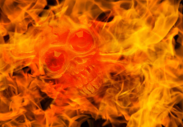 istock skull in fire close up. halloween concept image 1054910330