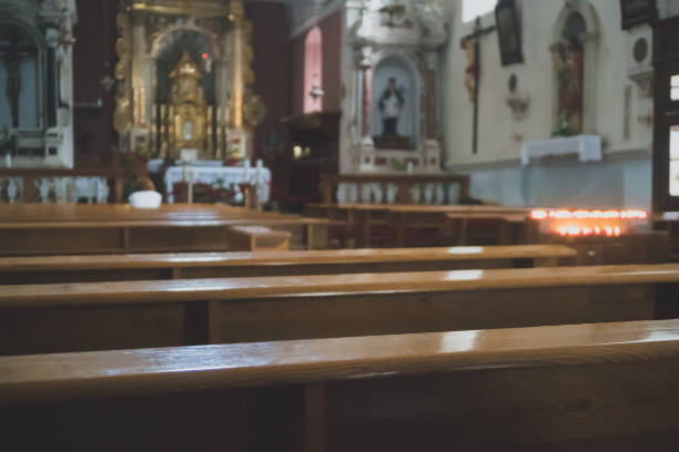 istock The interior of the church with benches. 1054910568